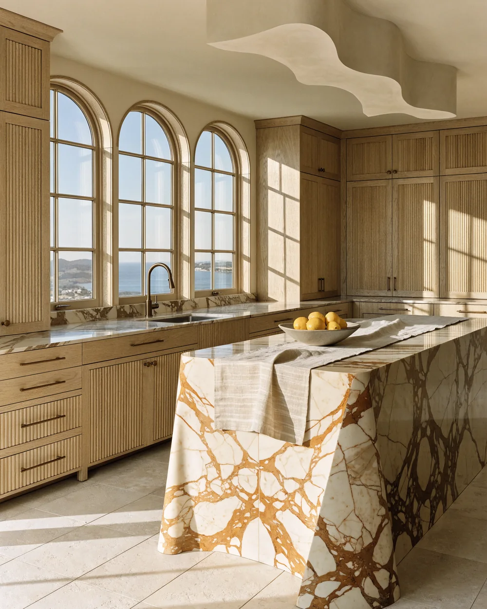 Minimal kitchen with marble waterfall island and white oak cabinetry